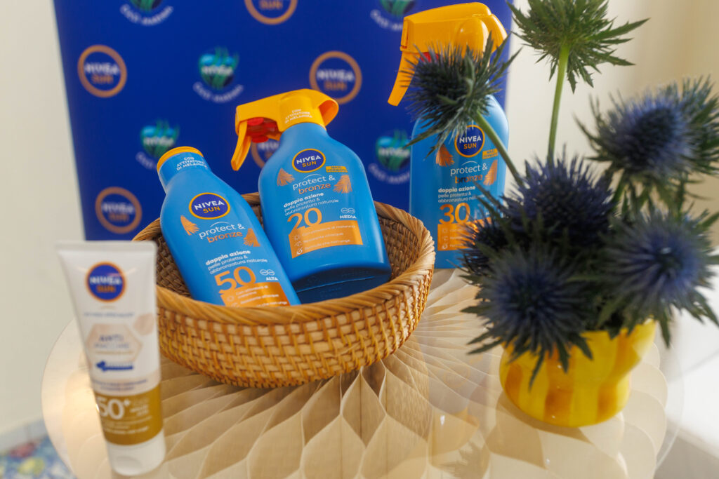 Nivea Sun Ischia 2 Cestino e pianta con prodotti solari Nivea Sun